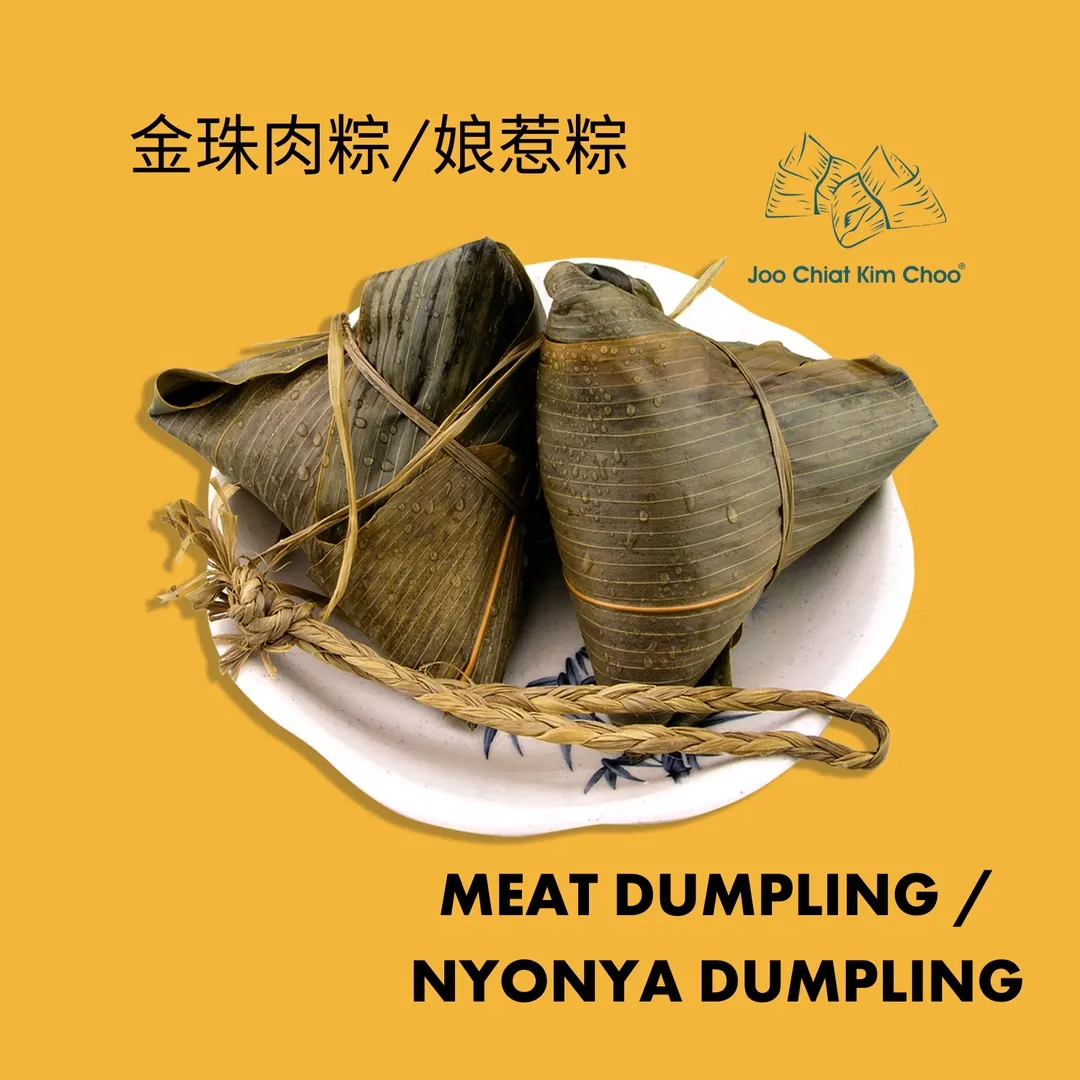 Two Joo Chiat Kim Choo rice dumplings wrapped in bamboo leaves