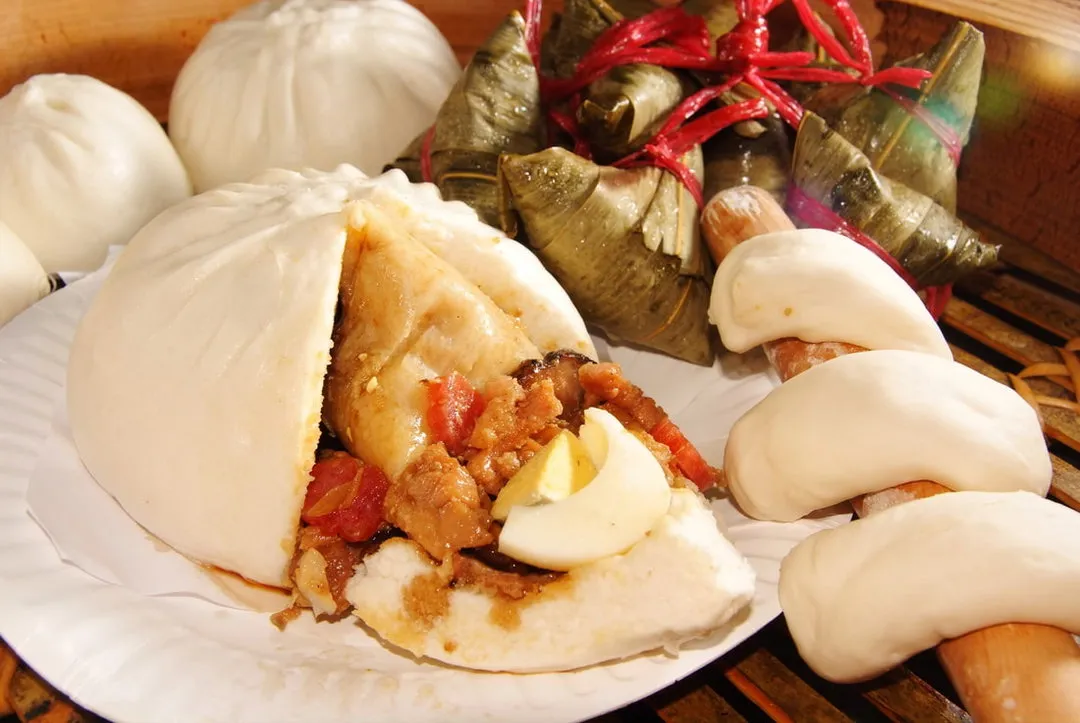 Sure-win jumbo pau cut open beside pau and rice dumplings